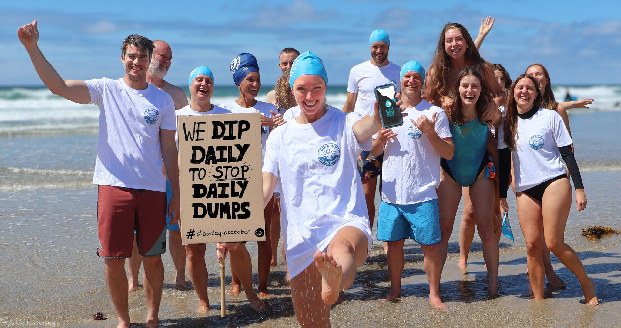 Dippers having fun and holding a placard