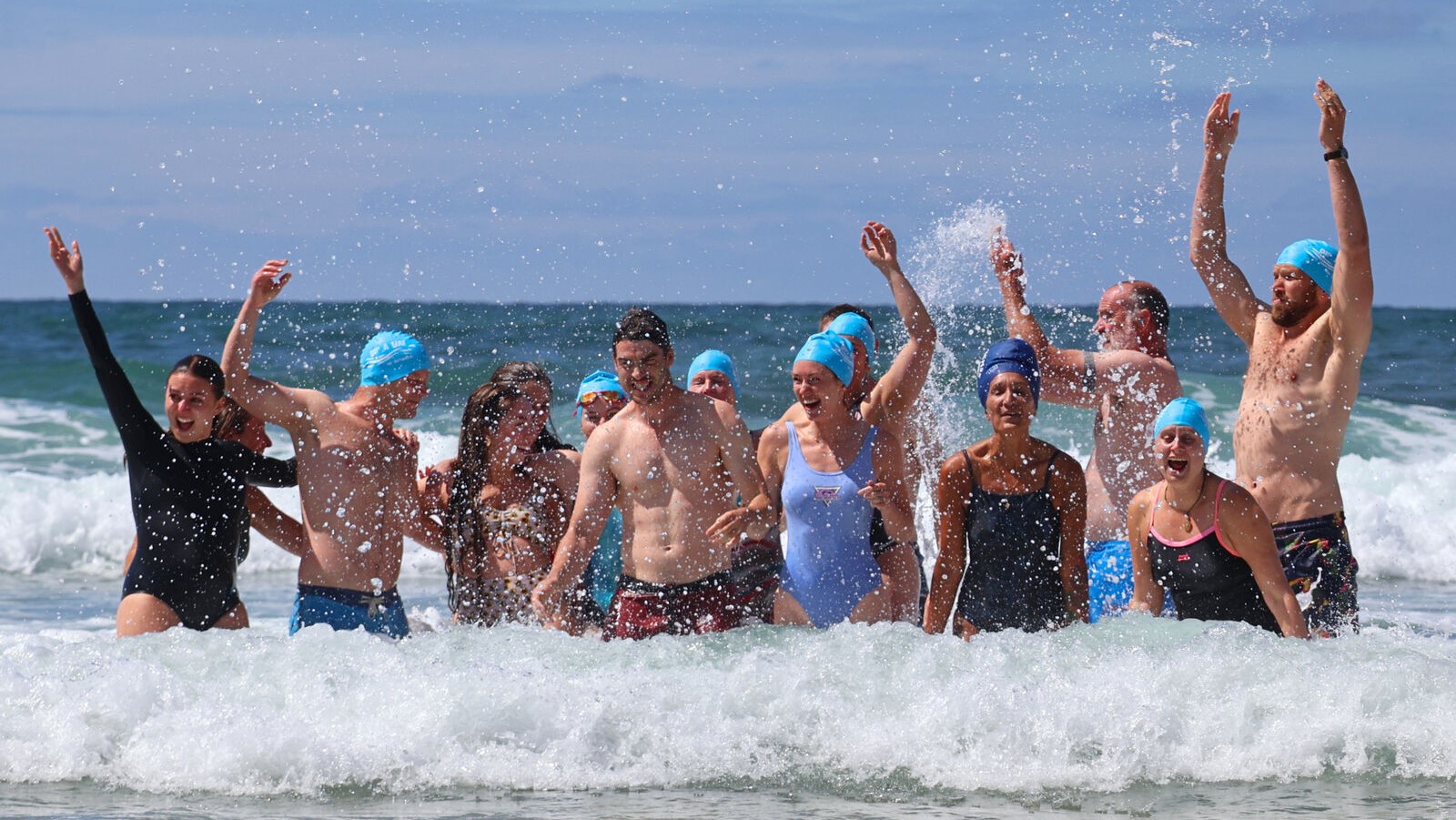 Crowd of dippers having fun in the sea