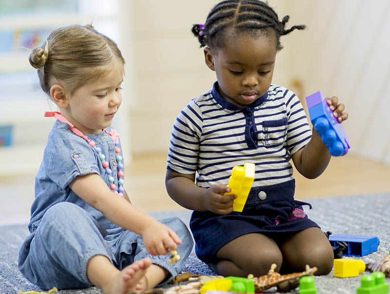 Two children playing with toys