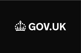 A white crown with dots and cross on a black background
