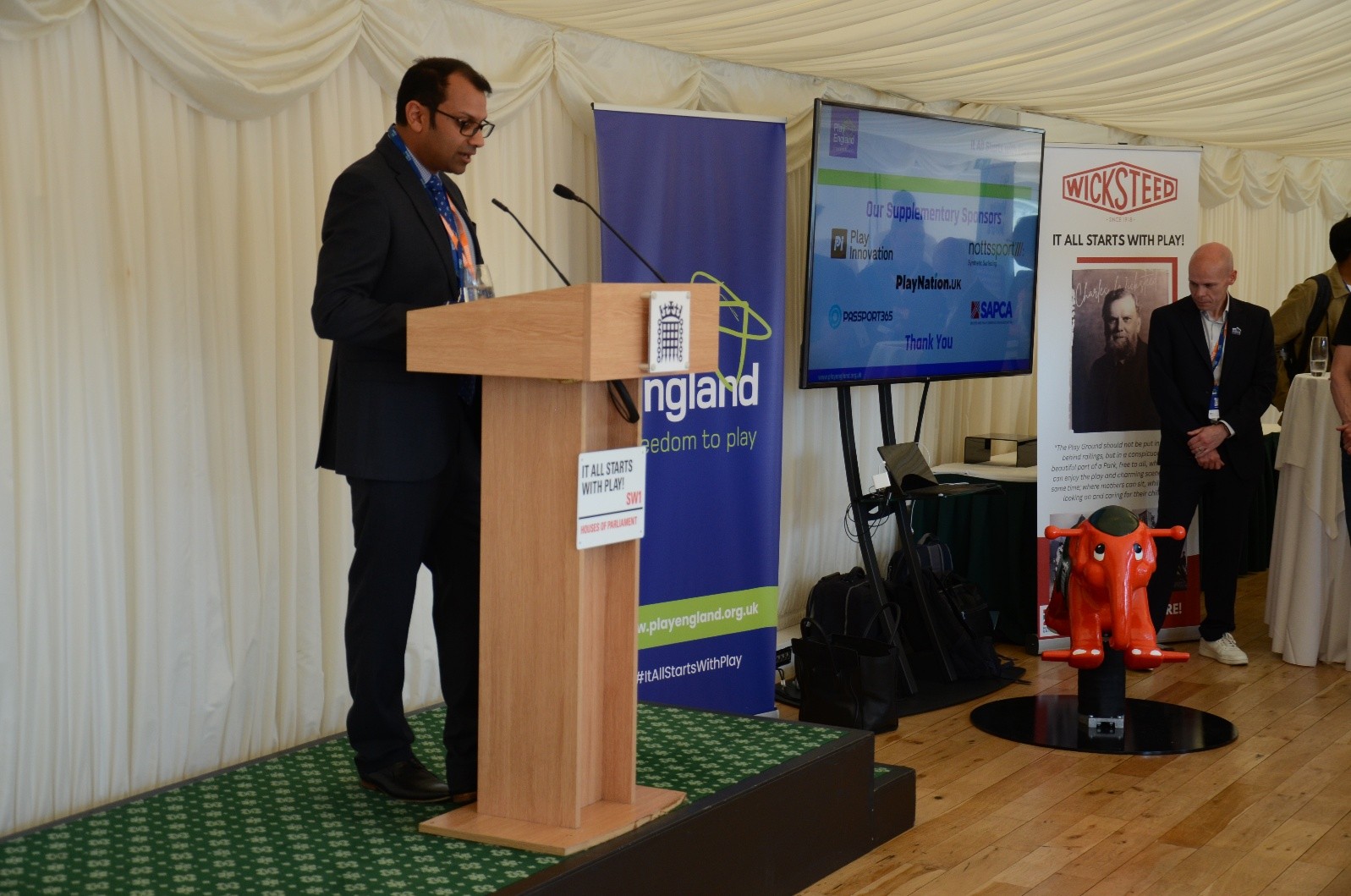 A person standing at a podium