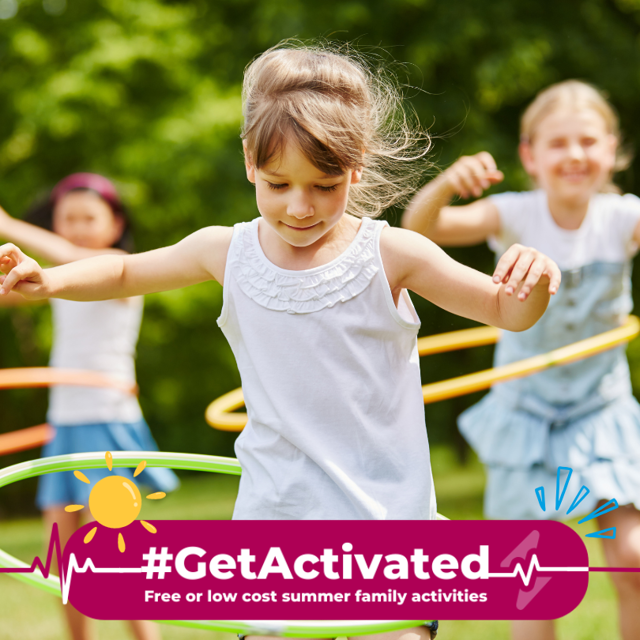 Photograph of three children playing with colourful hula hoops outdoors in a green park, promoting physical activity and fun. A magenta banner at bottom displays "#GetActivated" with a sun icon and text "Free or low cost summer family activities," encouraging active summer engagement.
