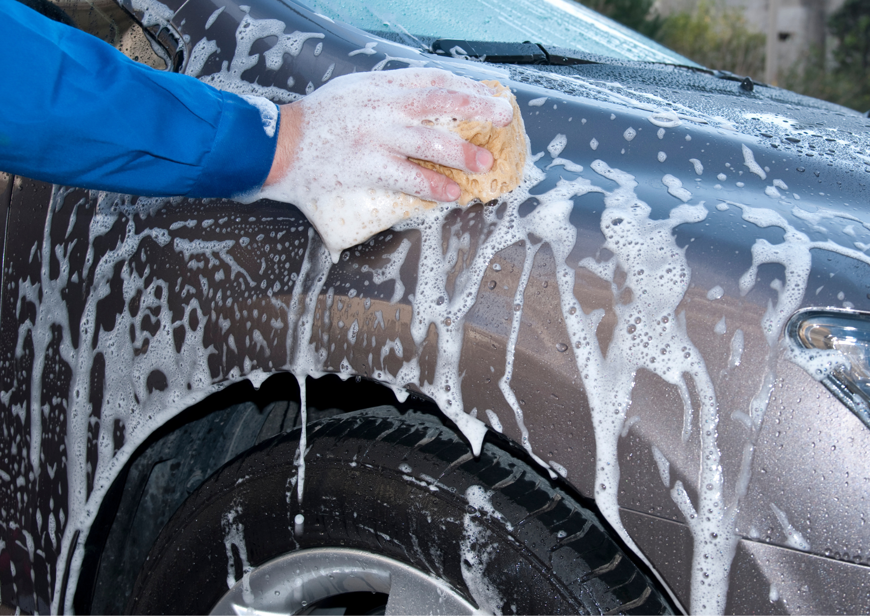 Image of a person washing a car