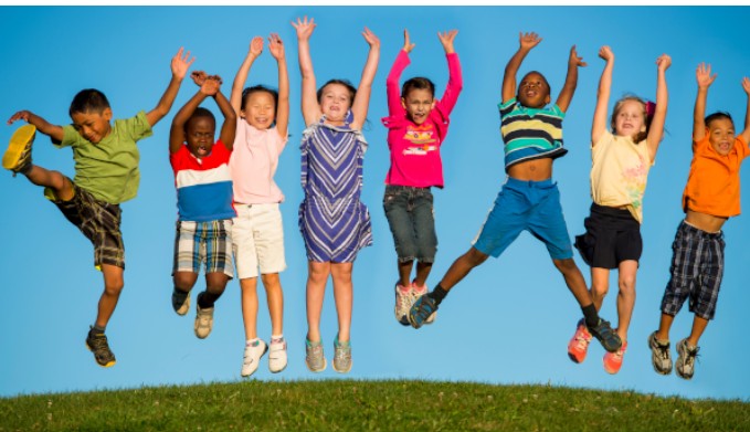 A row of children jumping of the ground