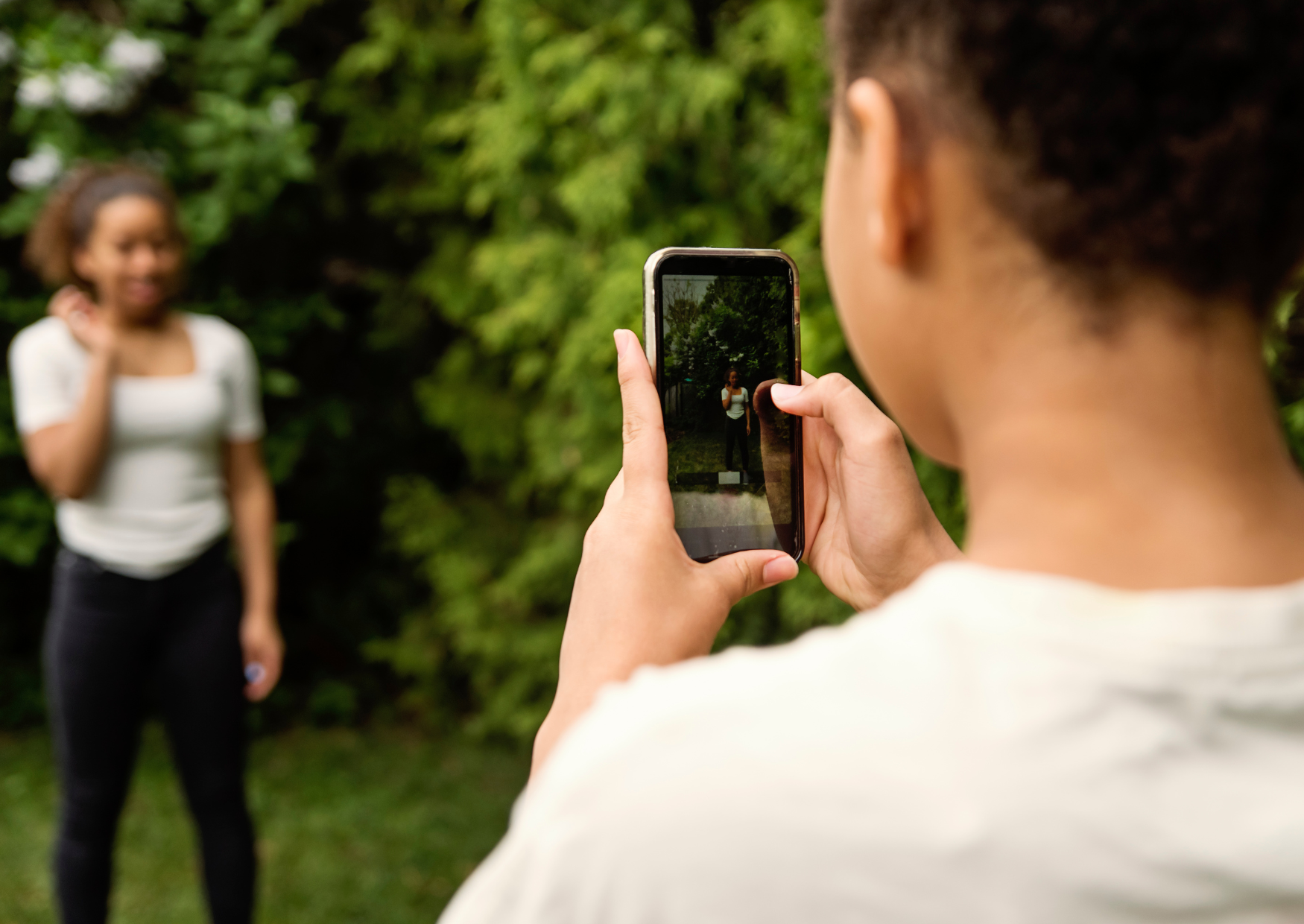 Teenagers filming on a mobile