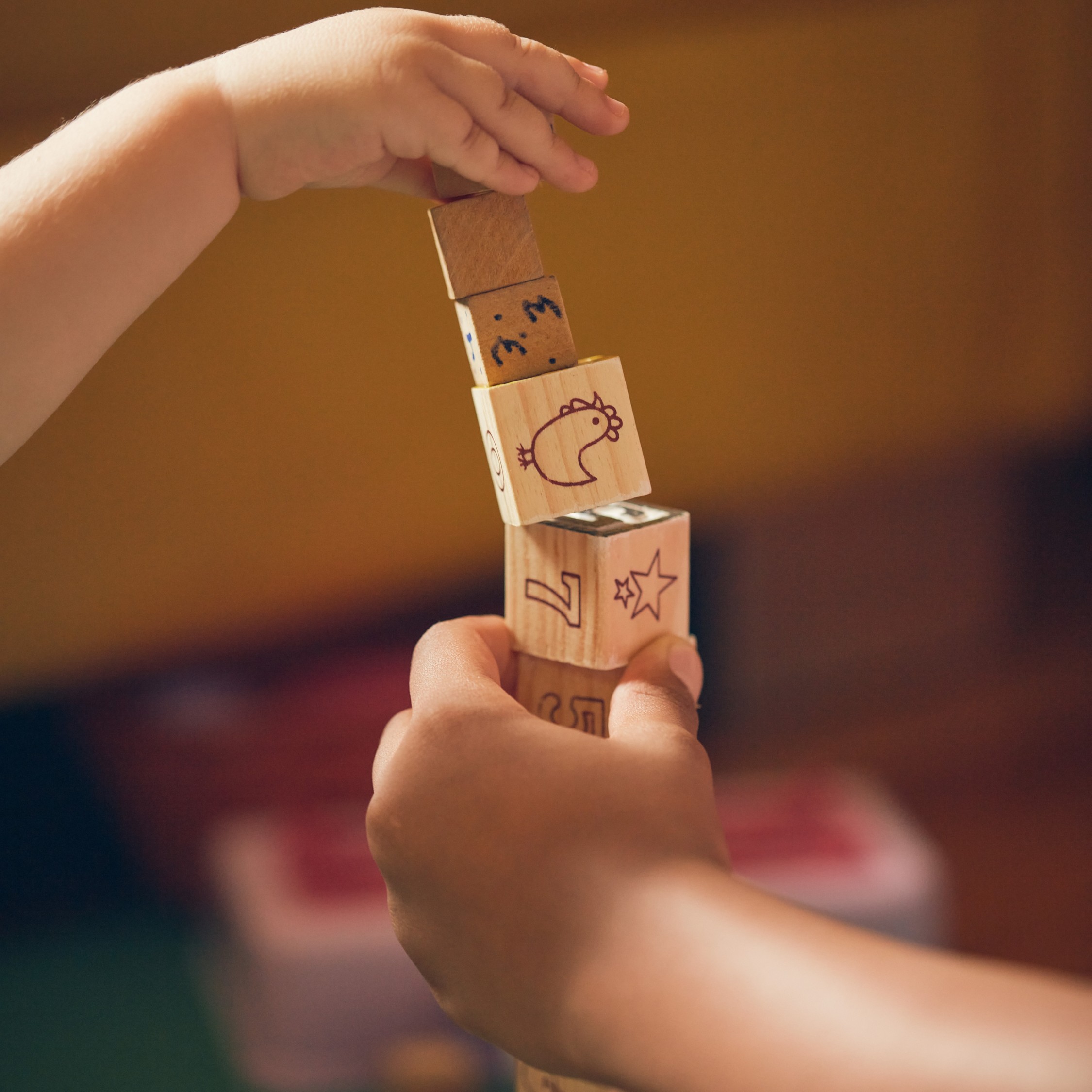Children playing with educational wooden blocks.