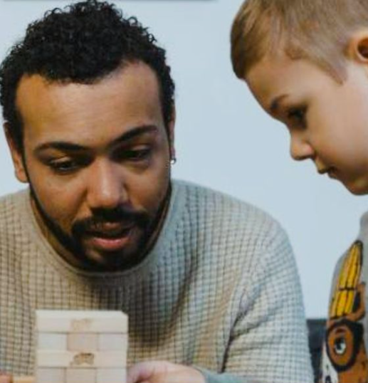 A person and child playing a game