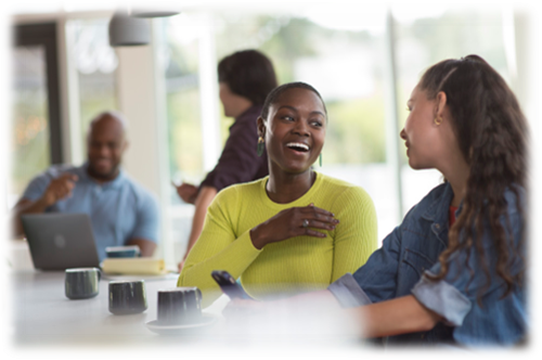 A casual meeting with four people sitting around a table
