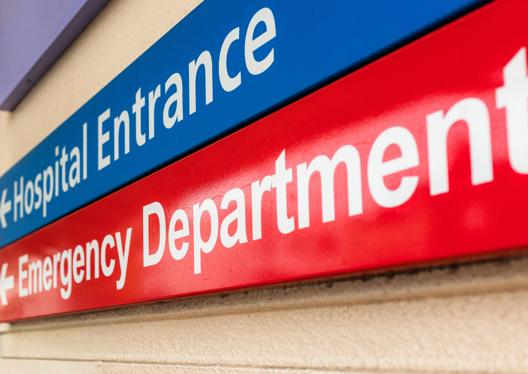 Sign with directions to the emergency department