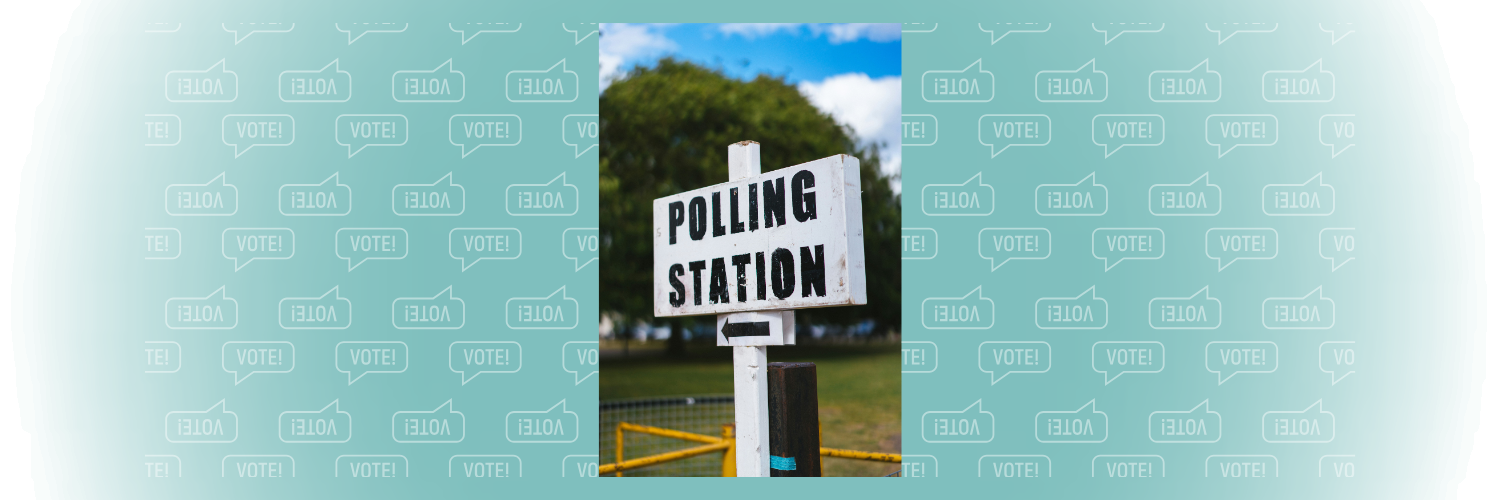 White post with directions to a polling station
