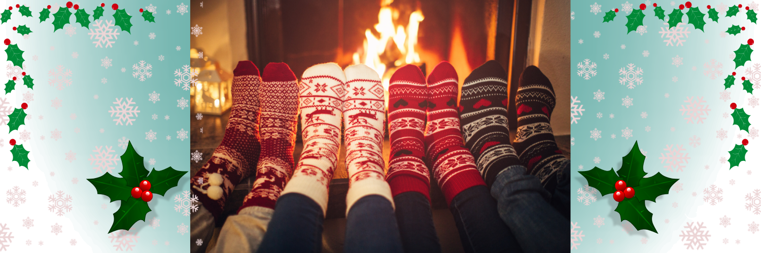Feet in winter socks by a fireplace