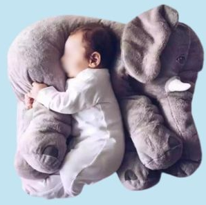 A baby sleeping on a stuffed elephant