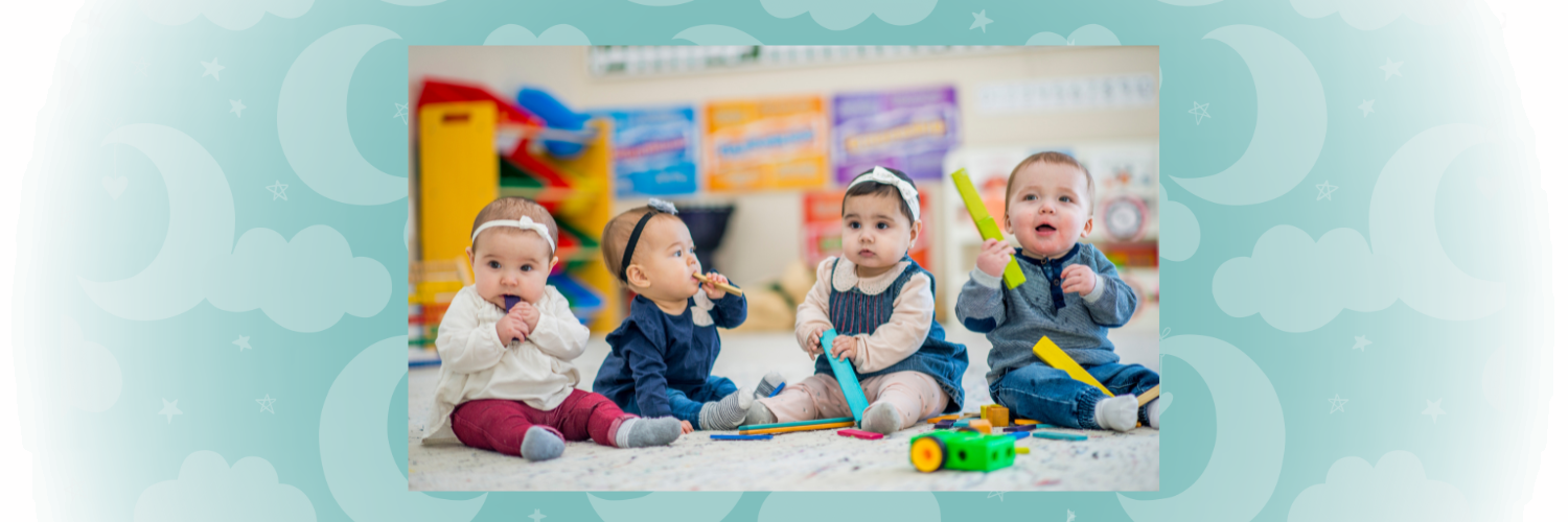 Image of four babies playing with toys, with a background of moons and stars