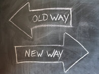 Two arrows on a chalkboard, the top arrow pointing left and marked 'Old Way', and the bottom arrow pointing right and marked 'New Way'.
