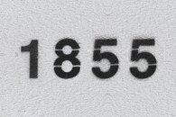 A wall stencil saying '1855'.