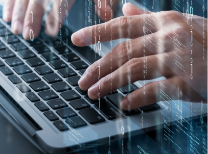 The hands of a laptop user typing on the keyboard, with transparent digital imagery overlaid.