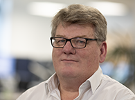 Head and shoulders portrait of Adam Hookway.