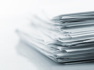 A pile of paper documents.