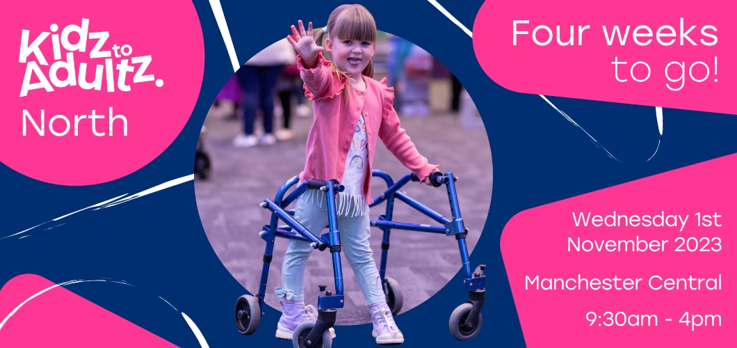 A blue and pink Kidz to Adultz banner image with text reading 'Four weeks to go! Wednesday 1st November 2023, Manchester Central, 9.30am  4pm.' The Kidz logo is in the top left and there's a photo of a little girl using a walker, waving at the camera