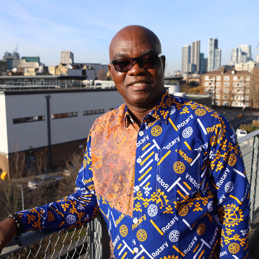 Yinka standing and smiling