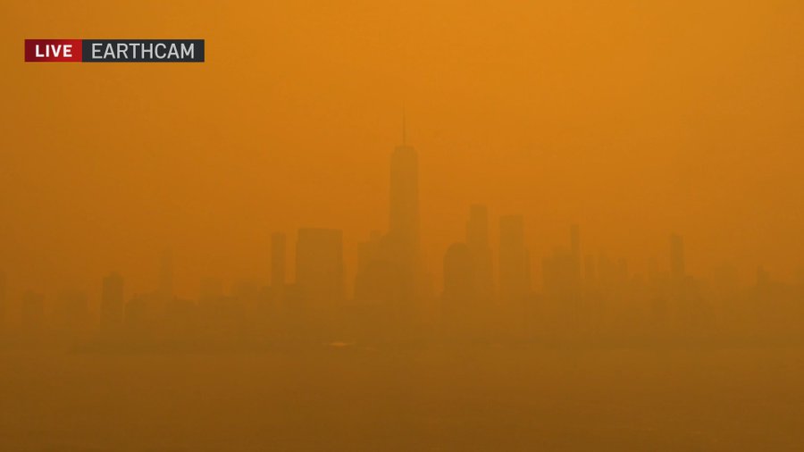 New York skyline is barely visible through the smog