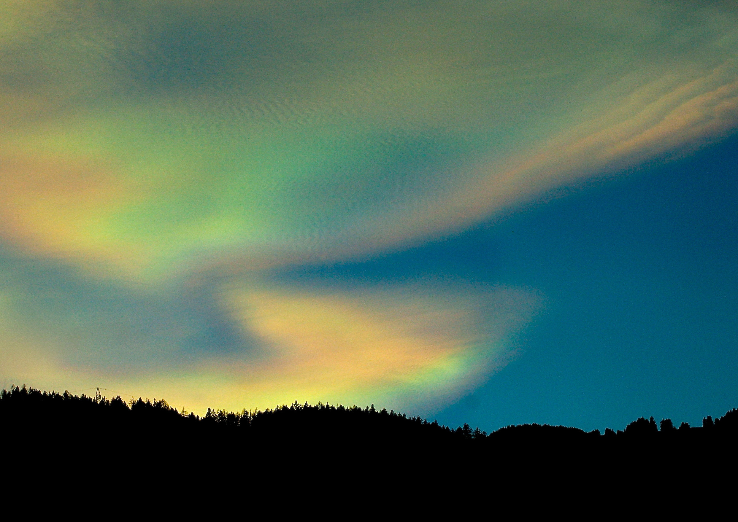 Colourful rare nacreous clouds by Helen Dacre